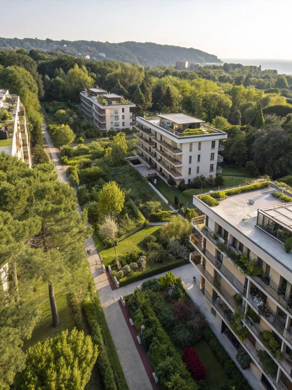 A high-angle photograph of a meticulously planned urban development project, showcasing green spaces integrated with modern architecture, symbolizing East Pillar's commitment to sustainable land use.